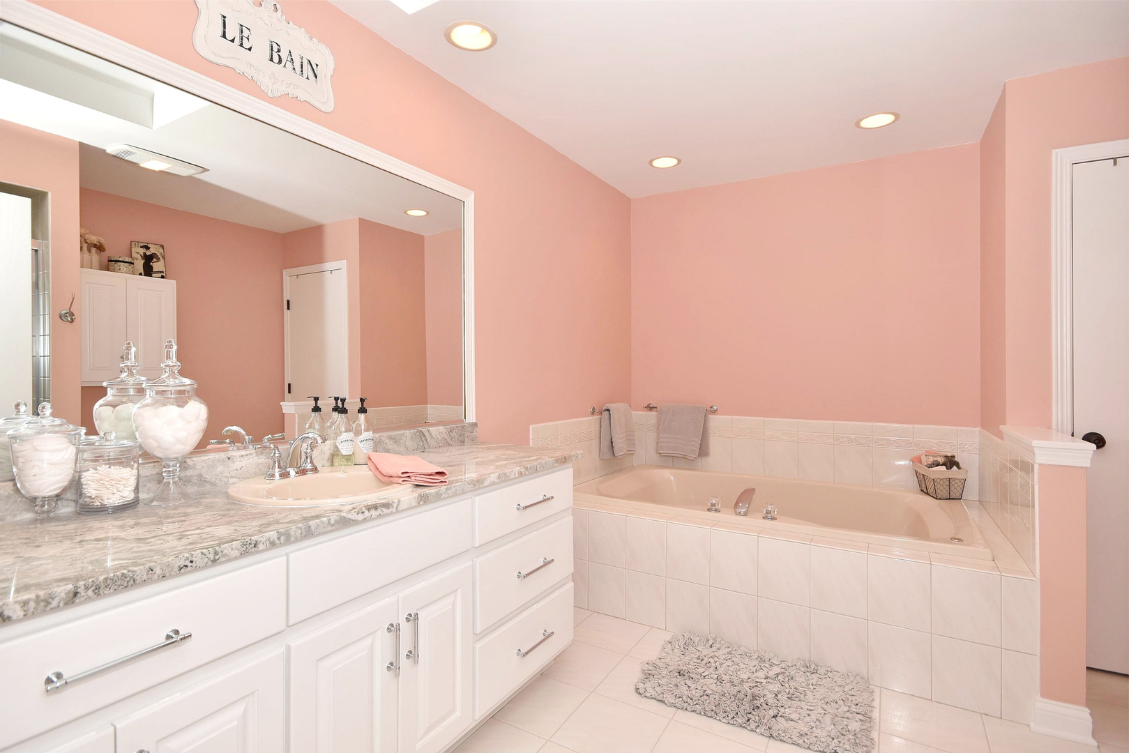 533 Lavina Drive Bolingbrook, IL 60440 - Photo 18 of 44 a bathroom with a granite countertop sink and a bathtub