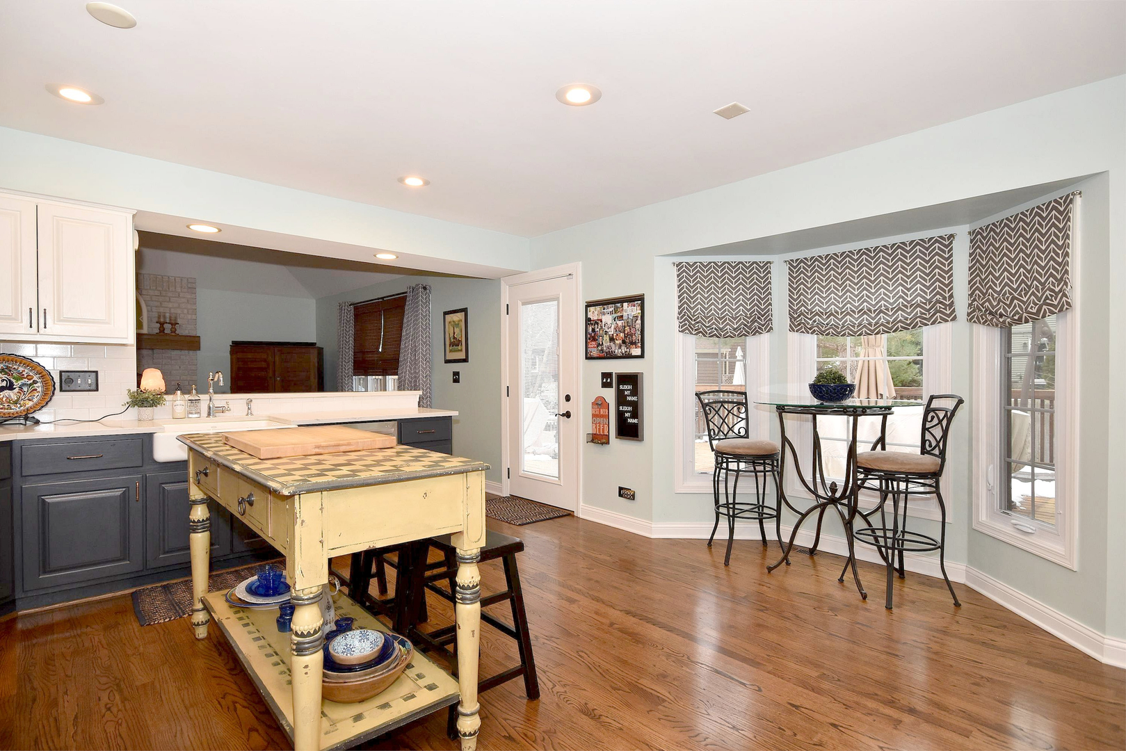 533 Lavina Drive Bolingbrook, IL 60440 - Photo 2 of 44 a open kitchen with stainless steel appliances granite countertop a table and chairs in it