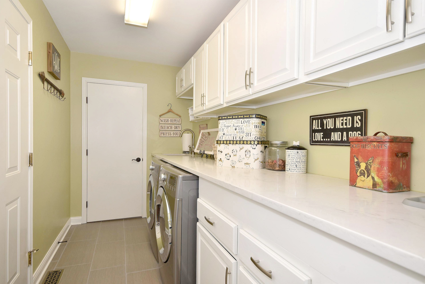 533 Lavina Drive Bolingbrook, IL 60440 - Photo 23 of 44 a utility room with stainless steel appliances granite countertop a sink and a cabinets