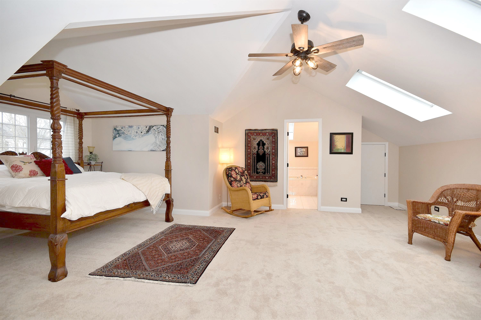 533 Lavina Drive Bolingbrook, IL 60440 - Photo 25 of 44 a bedroom with a large bed and a chandelier