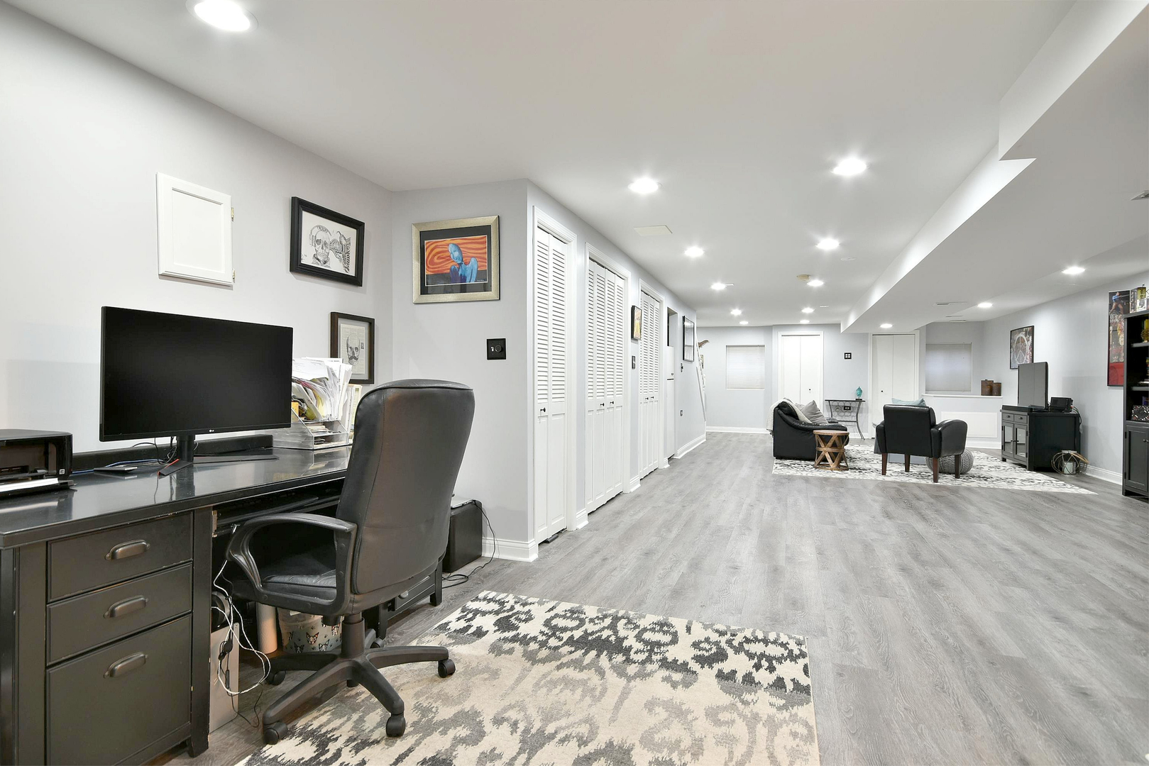533 Lavina Drive Bolingbrook, IL 60440 - Photo 34 of 44 a view of a workspace with furniture and a flat screen tv