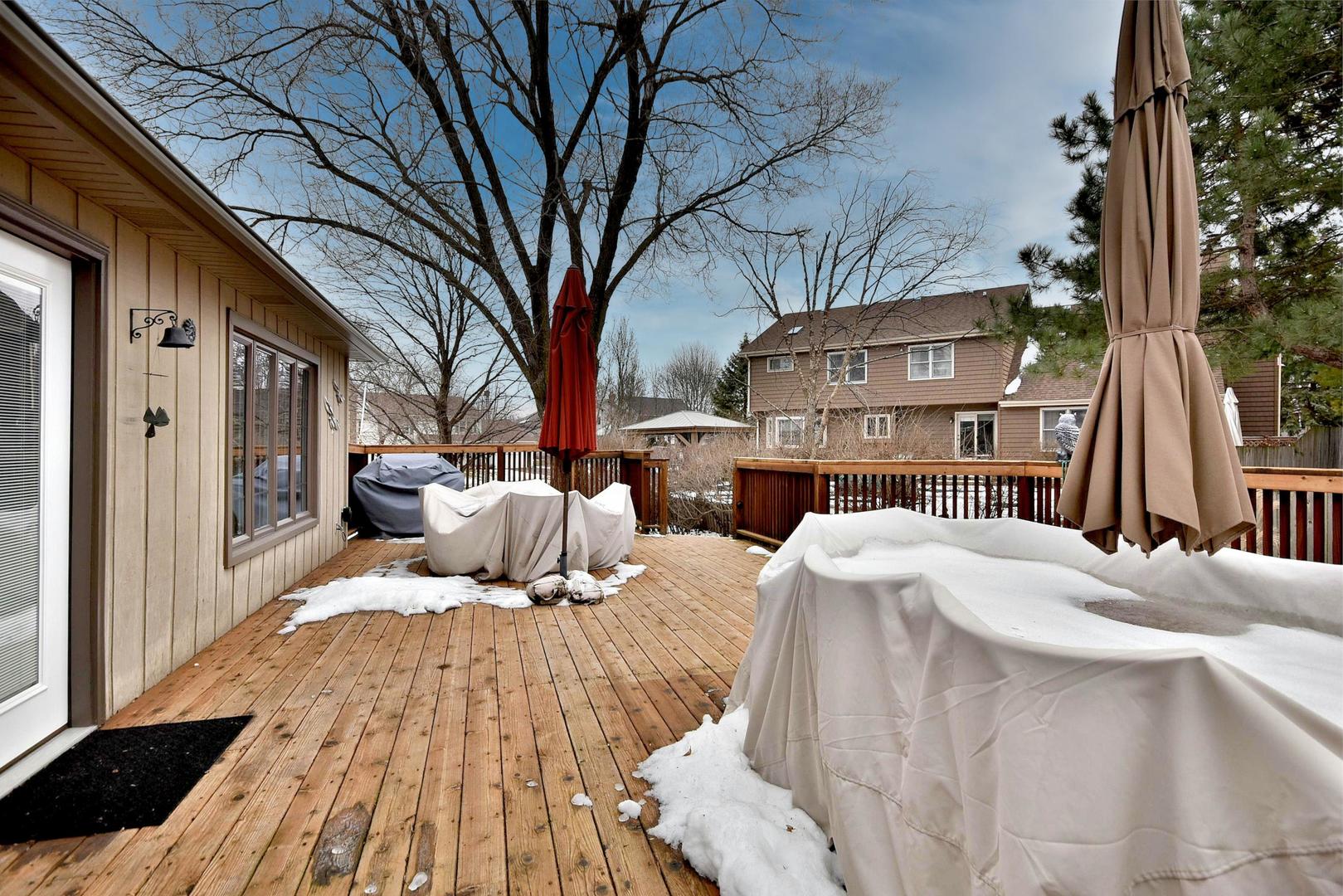 533 Lavina Drive Bolingbrook, IL 60440 - Photo 40 of 44 a view of a backyard with wooden fence and large trees