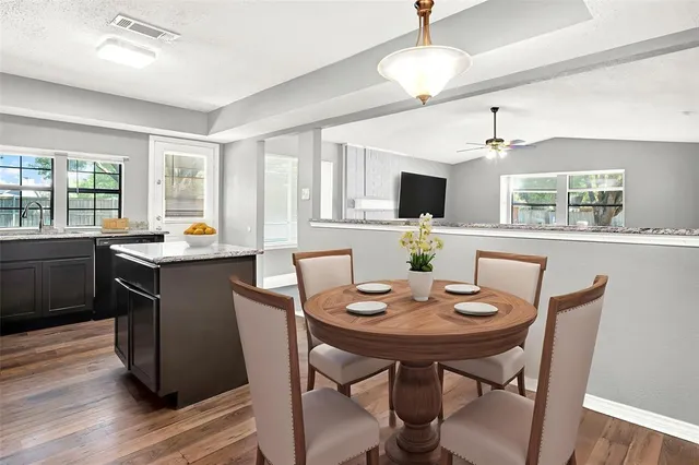 a open dining room with furniture and window