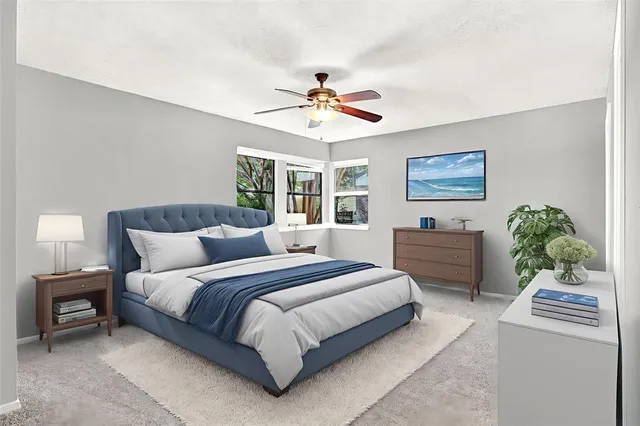 a bedroom with bed and a chandelier