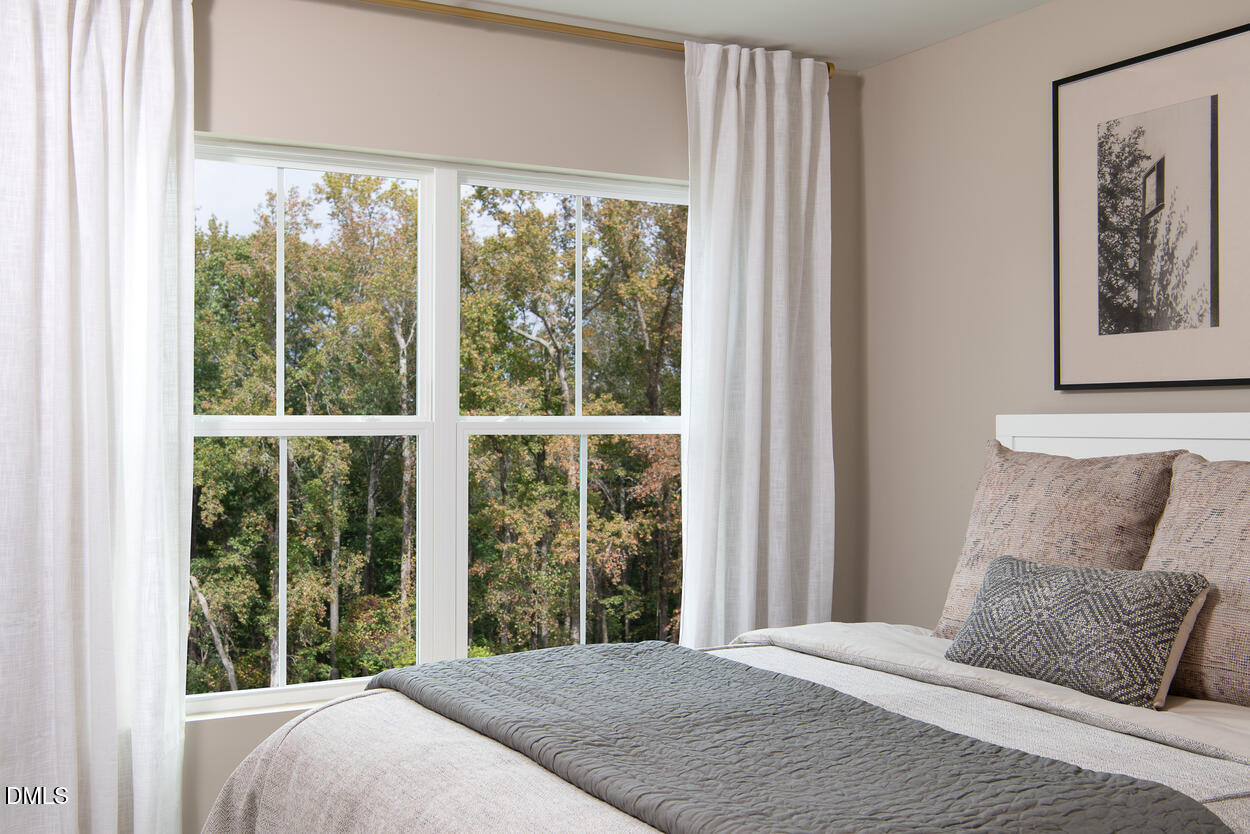 1511 Mirth Court Rolesville, NC 27571 - Photo 13 of 30 a bedroom with a large window and a large window