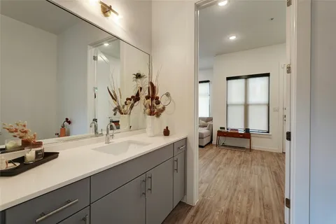 a bathroom with a sink double vanity and a mirror