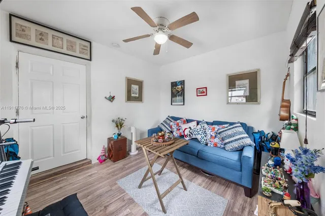 a view of backyard with wheel chair potted plant and a large window