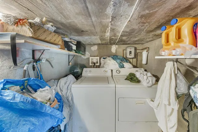 a bed room with a bed and a chandelier