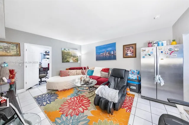 a bedroom with a bed and flat screen tv