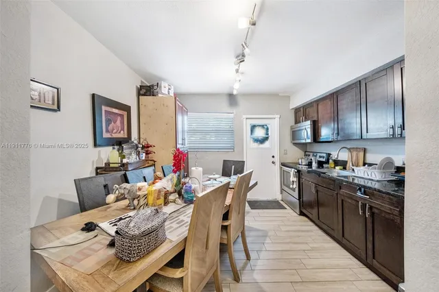 a view of a car park in front of a house