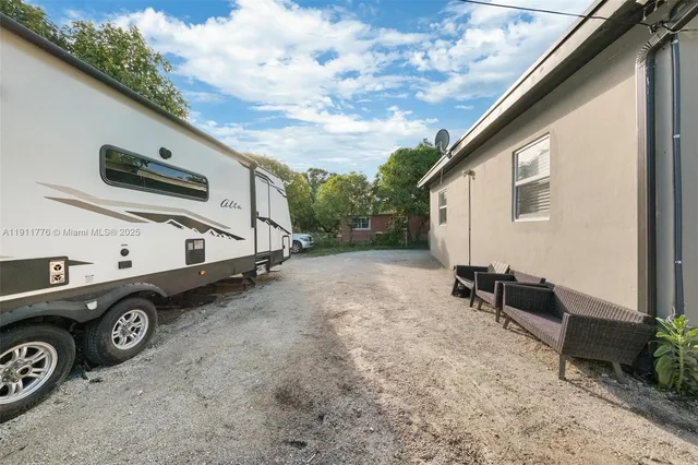 an aerial view of a house with a lake view