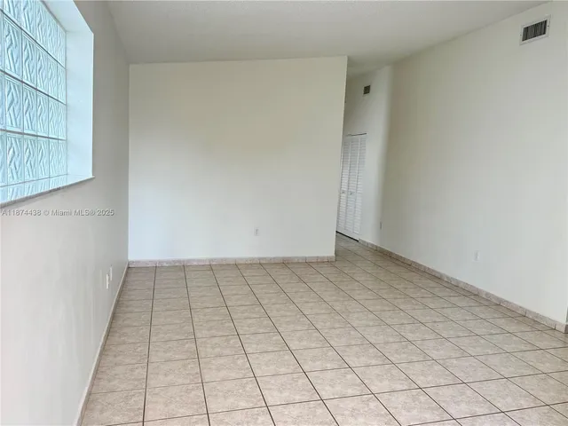 a view of an empty room and window