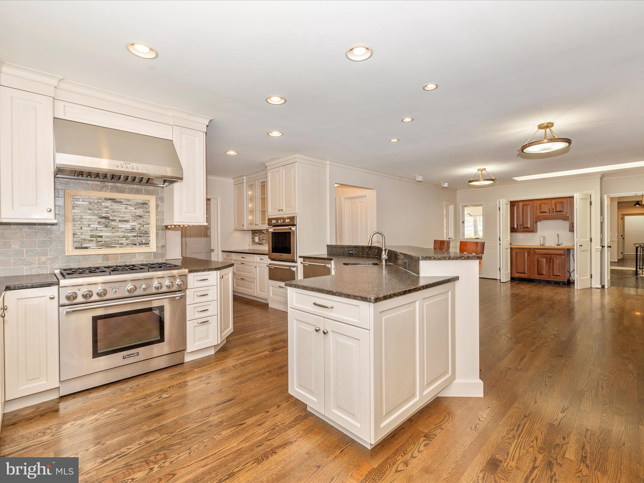 7702 Dance Hall Road Frederick, MD 21701 - Photo 19 of 66 a kitchen with a stove top oven sink and cabinets