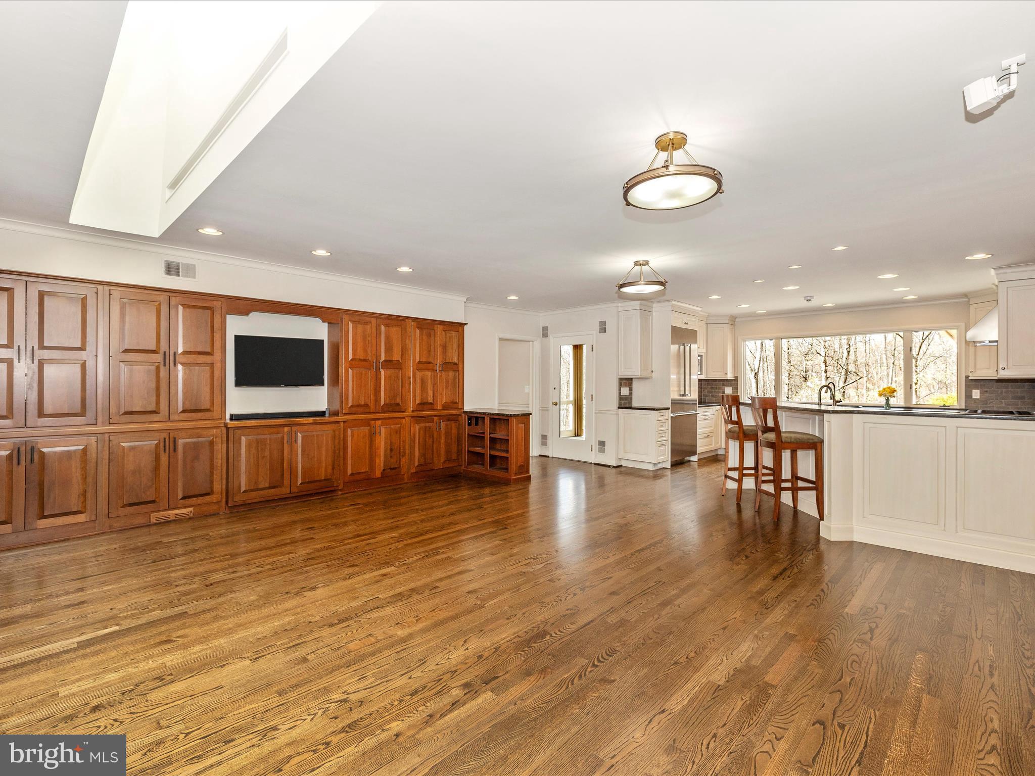 7702 Dance Hall Road Frederick, MD 21701 - Photo 23 of 66 a view of a living room and kitchen with stainless steel appliances