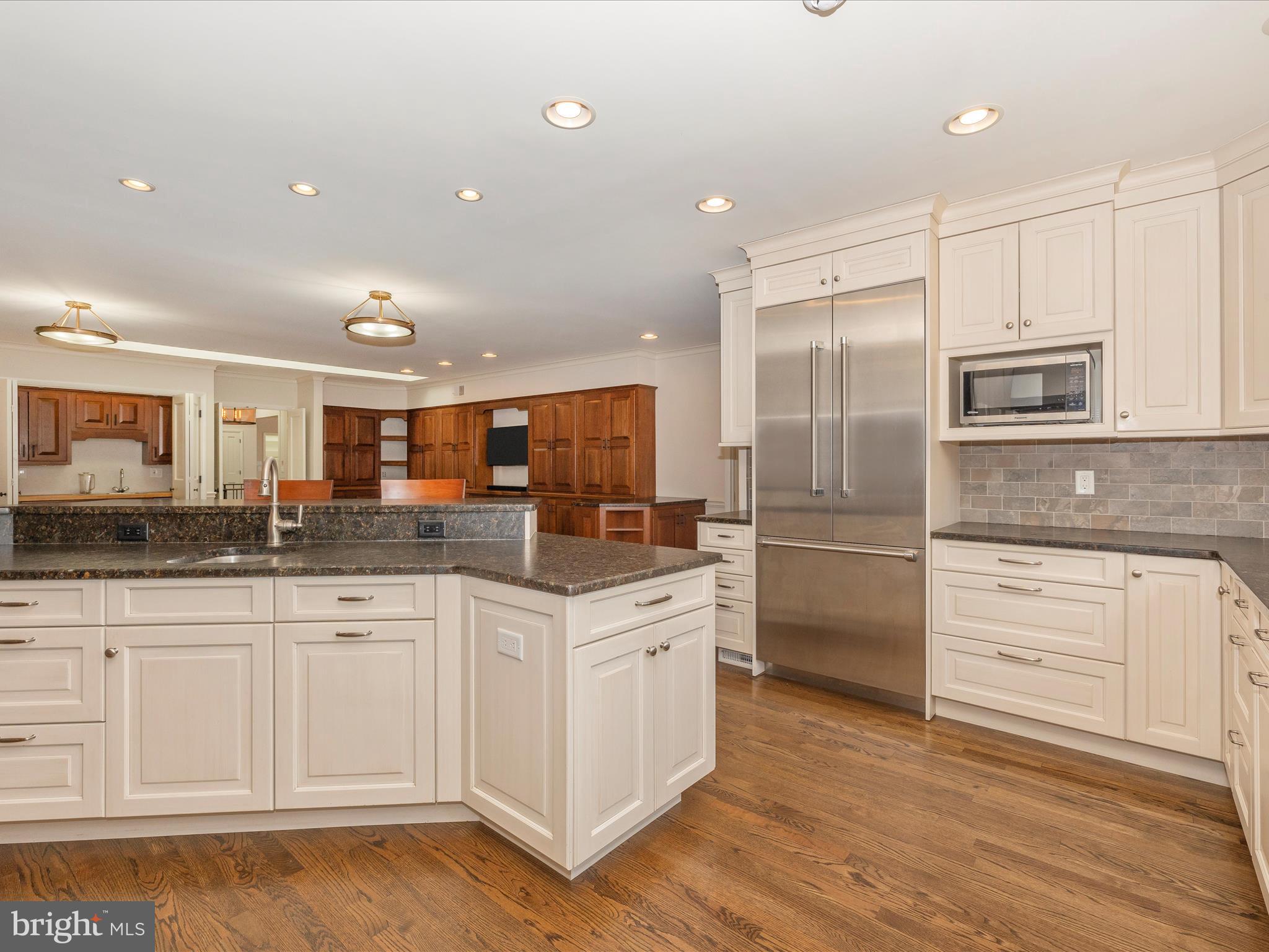 7702 Dance Hall Road Frederick, MD 21701 - Photo 24 of 66 a kitchen with stainless steel appliances granite countertop a sink and cabinets