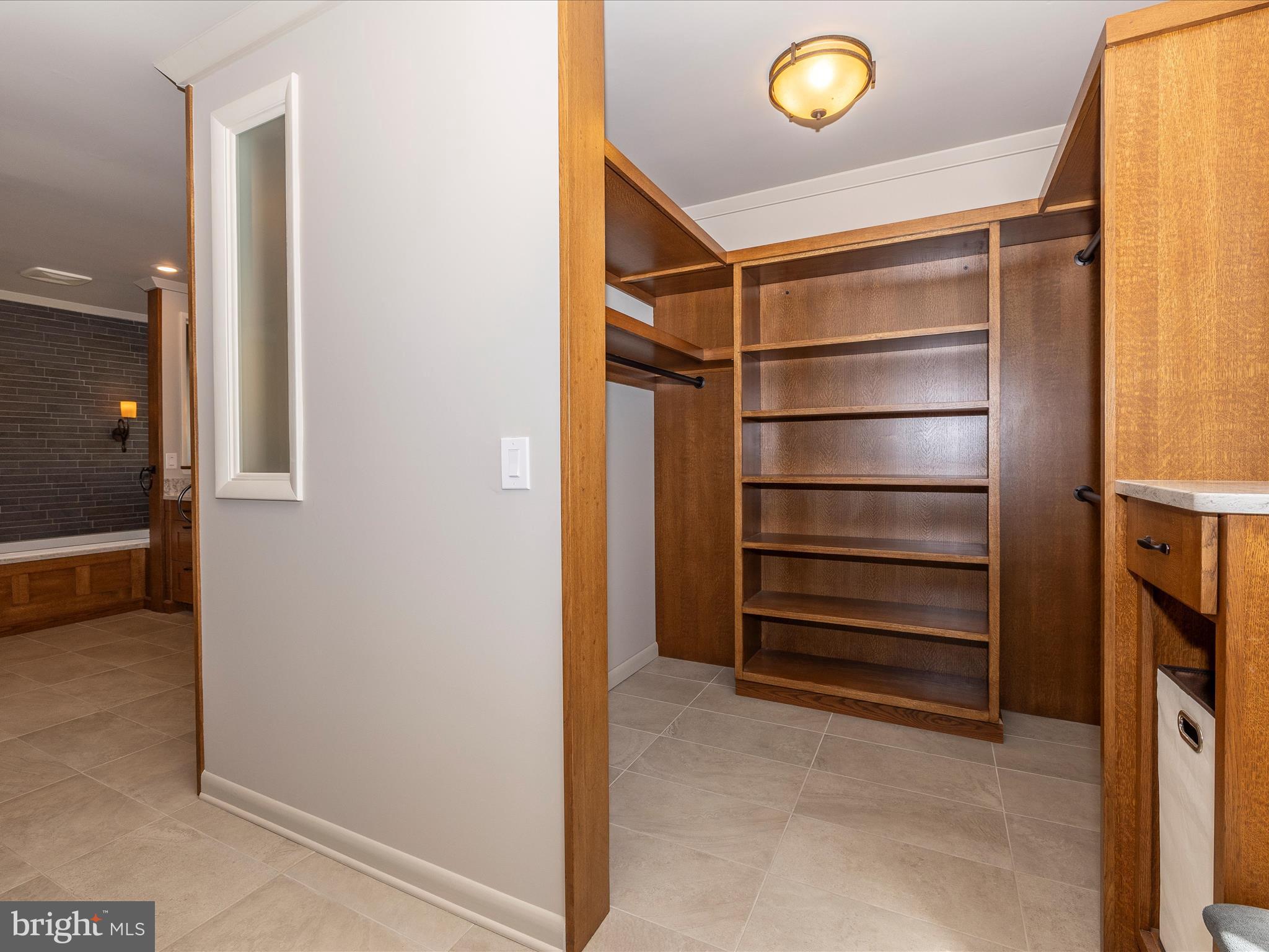7702 Dance Hall Road Frederick, MD 21701 - Photo 41 of 66 a view of walk in closet with empty racks