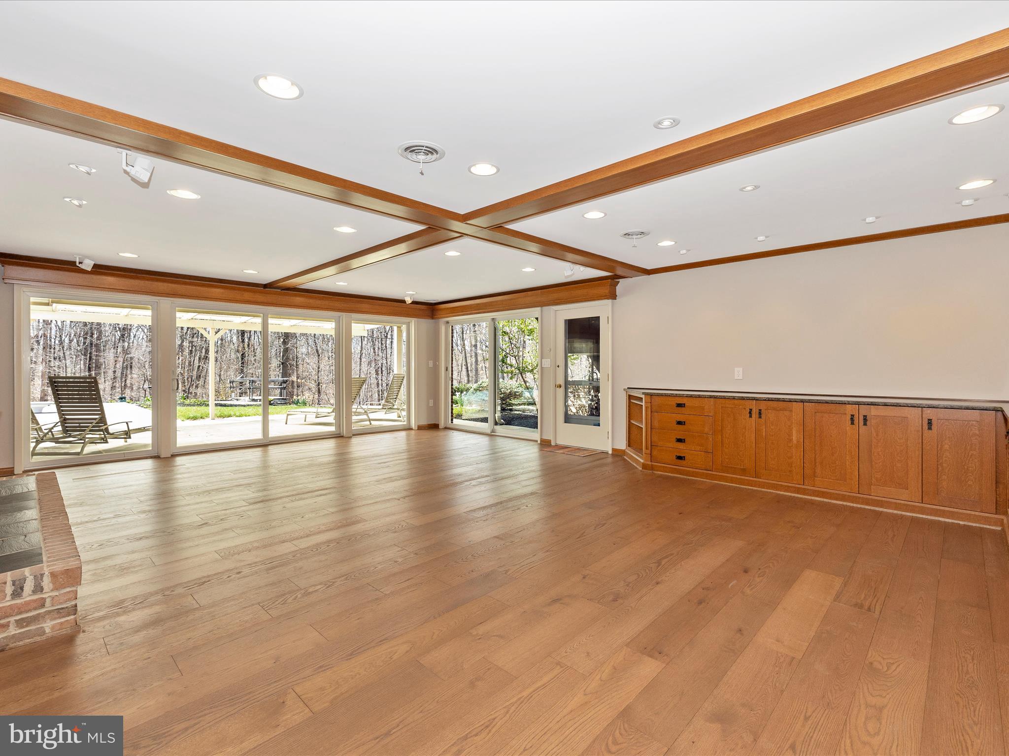 7702 Dance Hall Road Frederick, MD 21701 - Photo 42 of 66 a view of an empty room with wooden floor and a window