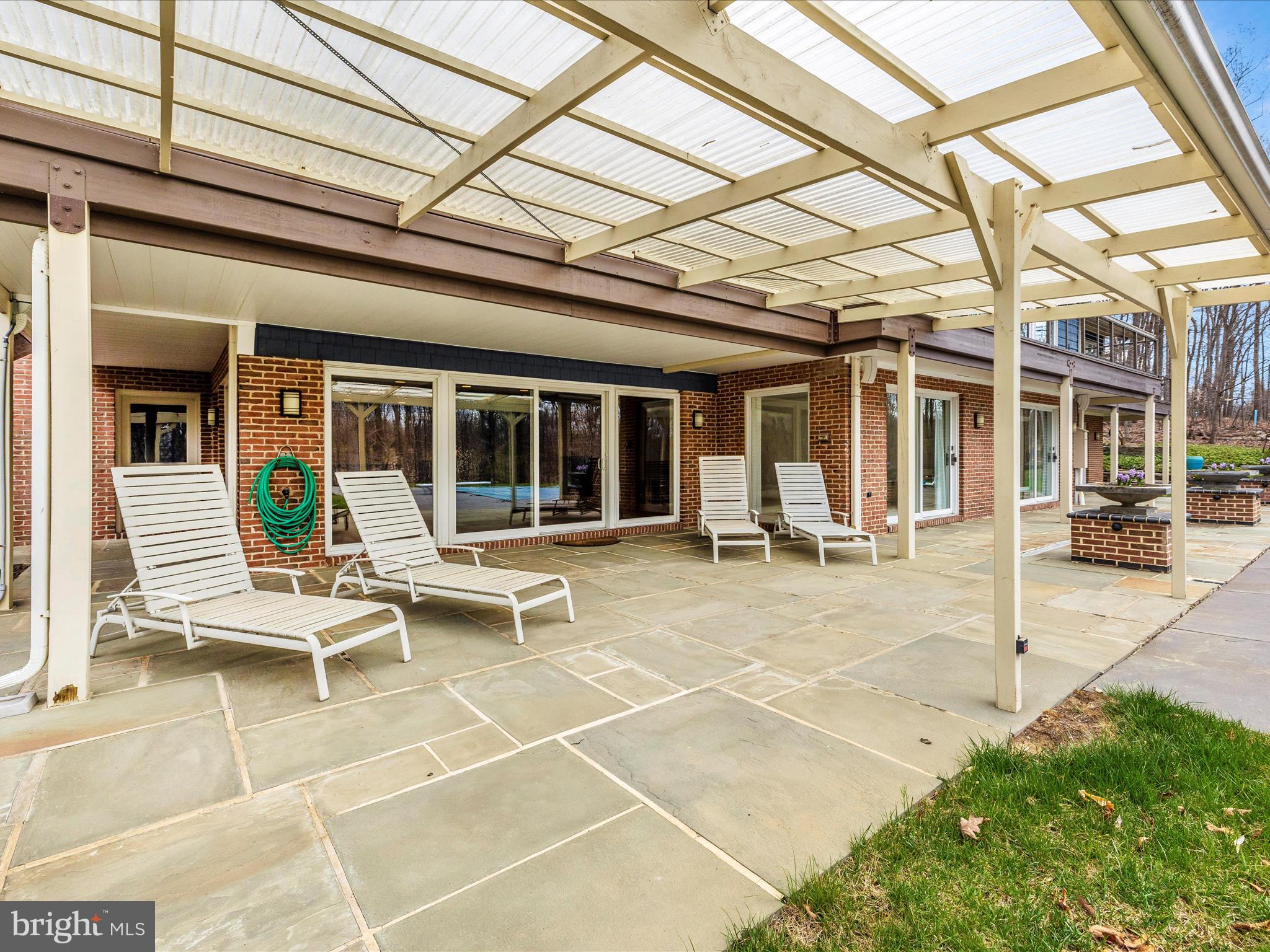 7702 Dance Hall Road Frederick, MD 21701 - Photo 44 of 66 a view of a patio with table and chairs with wooden floor and fence