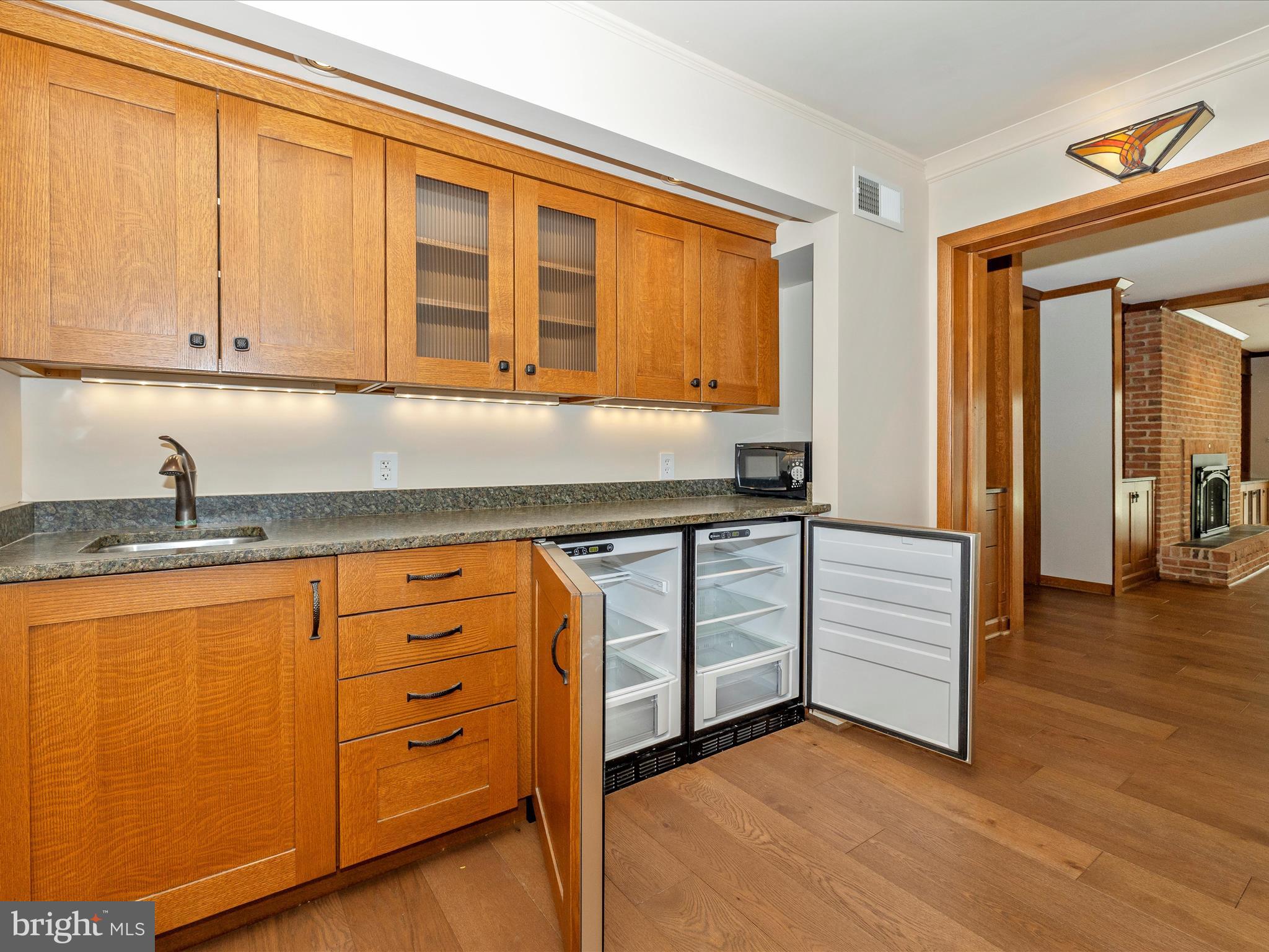 7702 Dance Hall Road Frederick, MD 21701 - Photo 48 of 66 a kitchen with granite countertop cabinets and wooden floor