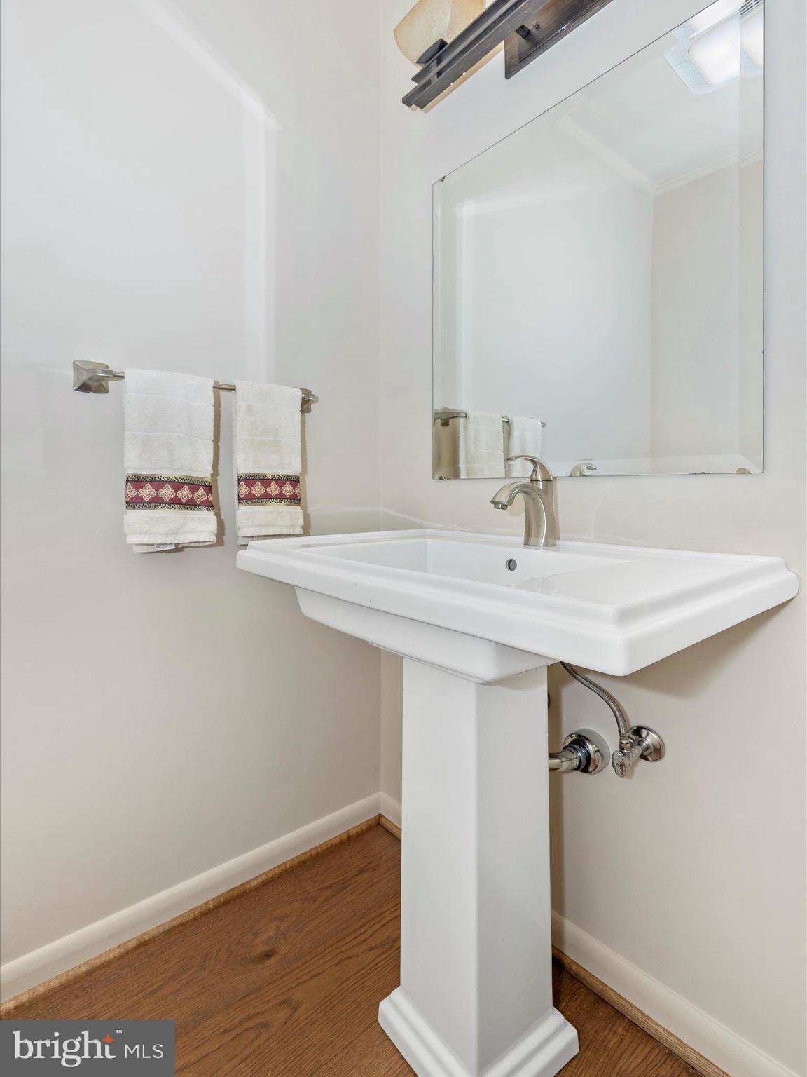 7702 Dance Hall Road Frederick, MD 21701 - Photo 49 of 66 a bathroom with a sink and a mirror