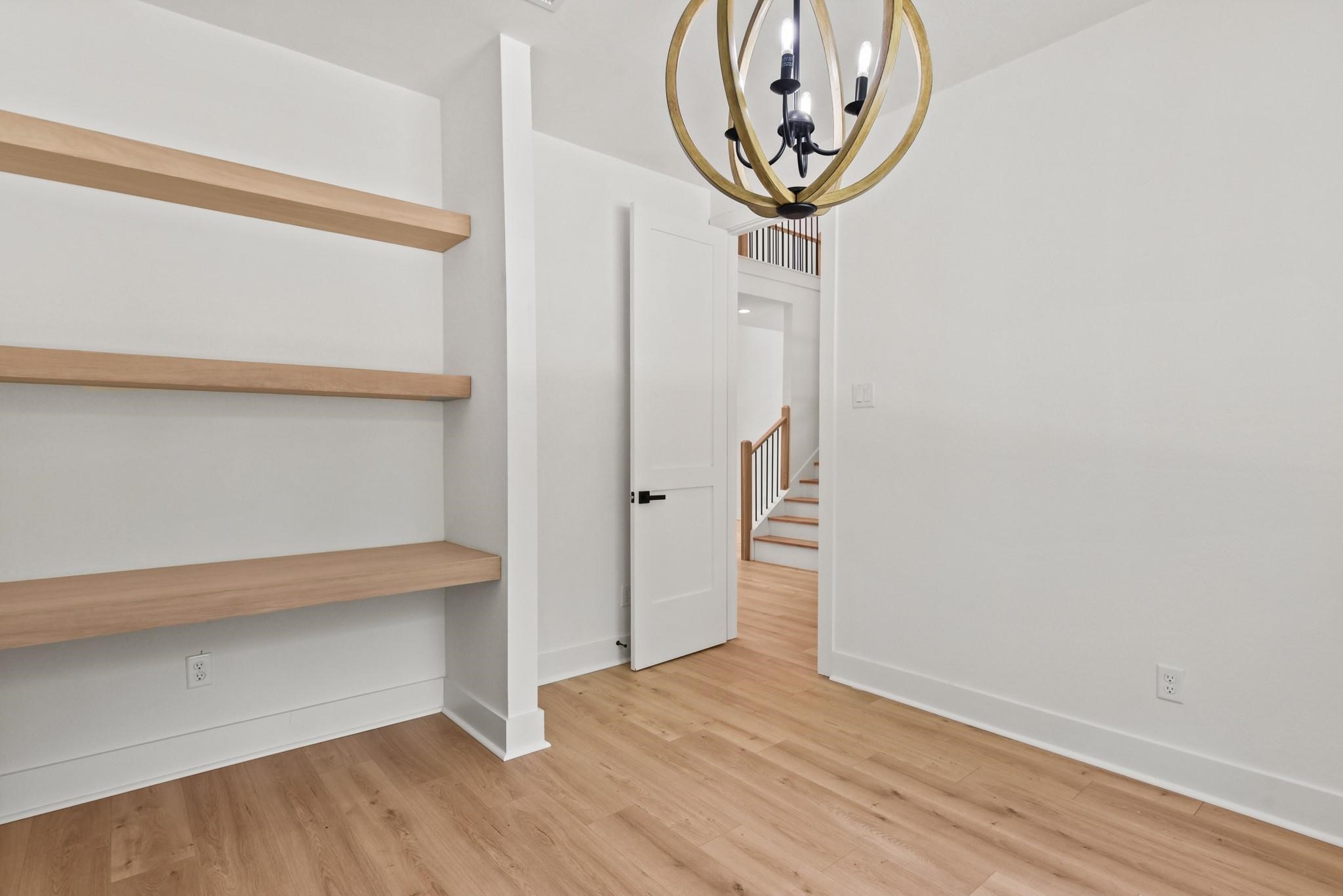 17068 Lively Road Waller, TX 77484 - Photo 13 of 29 a view of a hallway with wooden floor