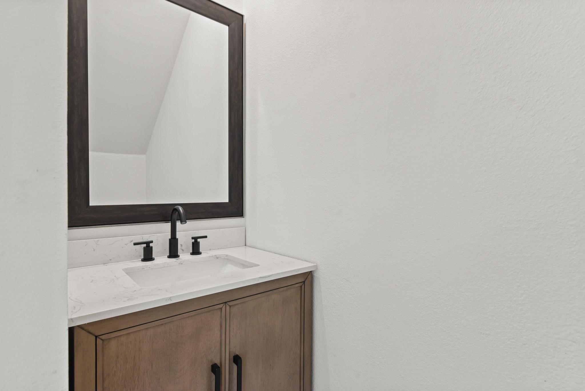17068 Lively Road Waller, TX 77484 - Photo 14 of 29 a bathroom with a sink and a mirror