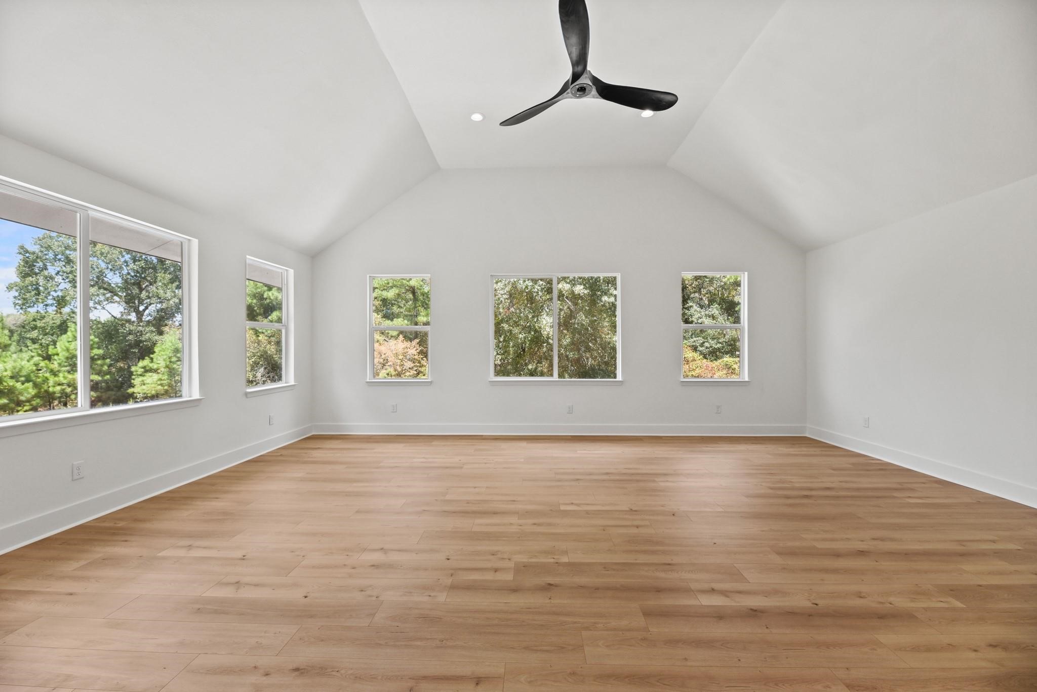 17068 Lively Road Waller, TX 77484 - Photo 18 of 29 a view of an empty room with wooden floor and a window