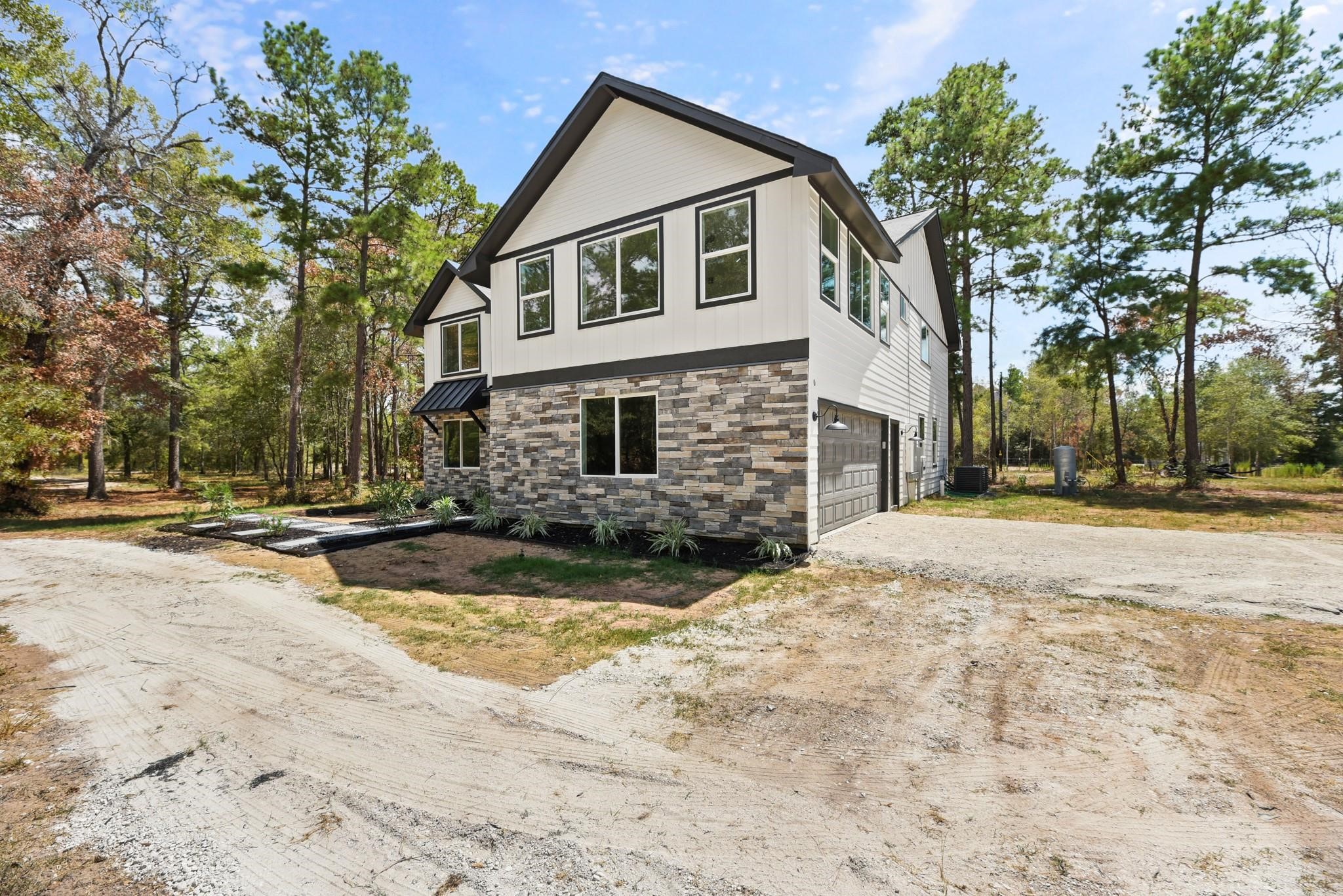 17068 Lively Road Waller, TX 77484 - Photo 2 of 29 a view of the house with snow yard