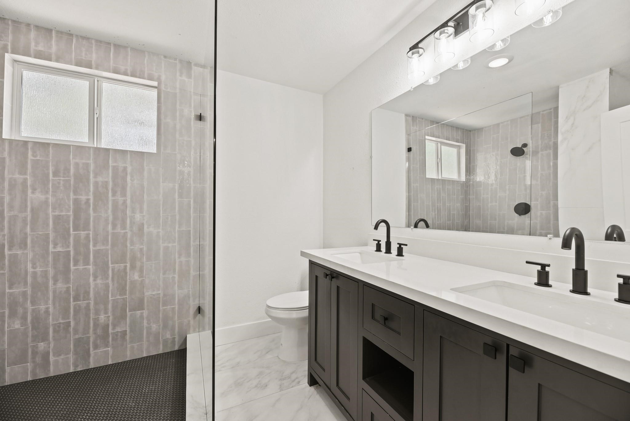 17068 Lively Road Waller, TX 77484 - Photo 25 of 29 a bathroom with a sink a toilet and shower