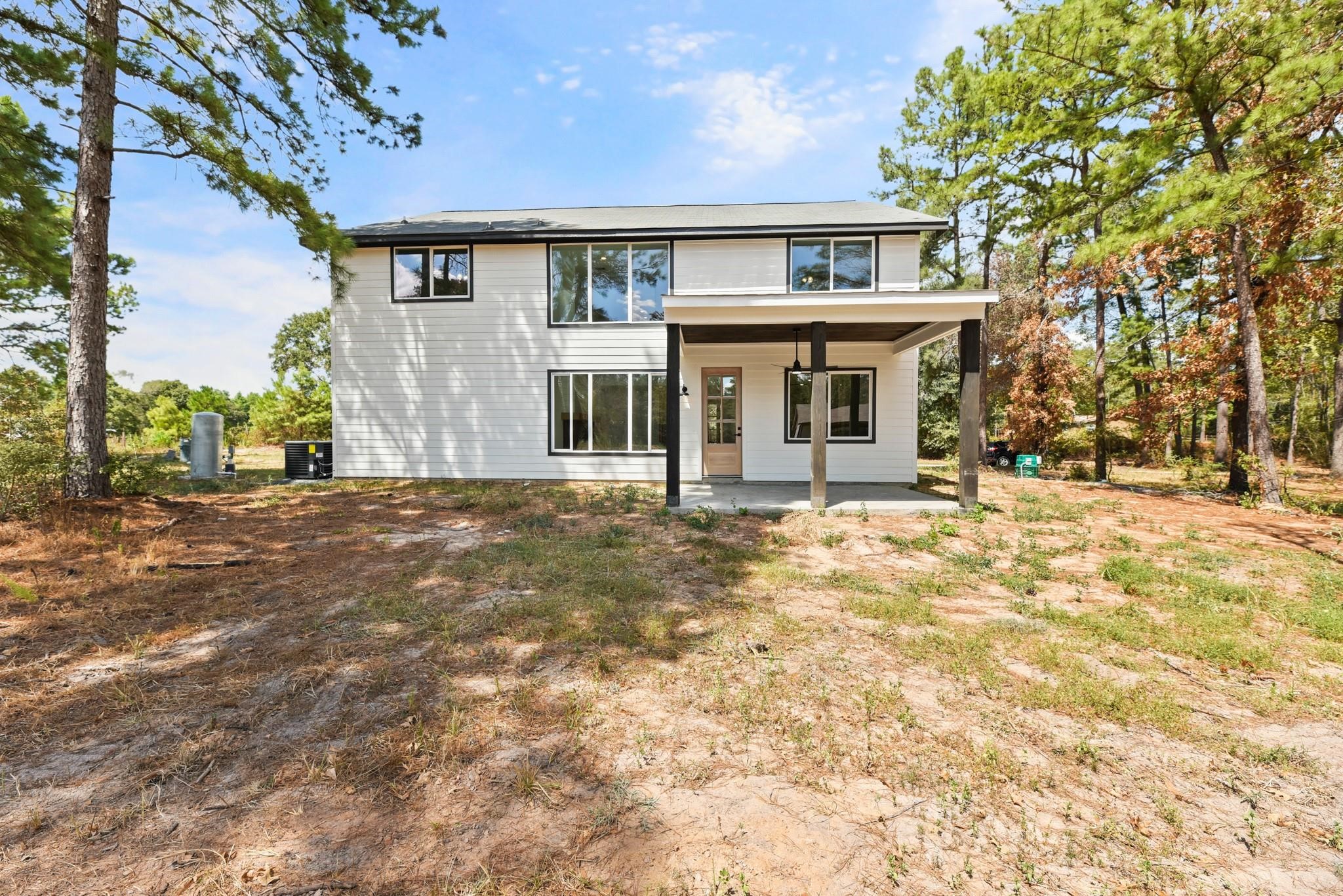17068 Lively Road Waller, TX 77484 - Photo 27 of 29 a front view of a house with a yard