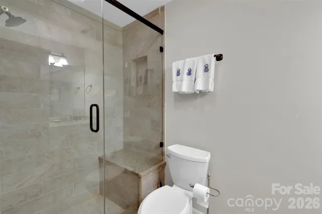 a white toilet sitting next to a bathroom sink