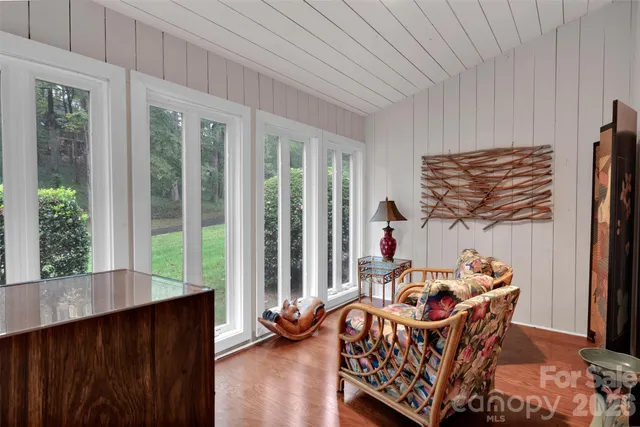 a bed room with furniture and a window