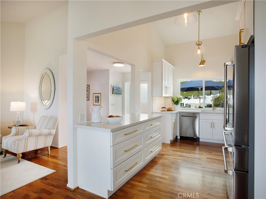 33525 Sextant Dana Point, CA 92629 - Photo 11 of 51 a kitchen with white cabinets and sink