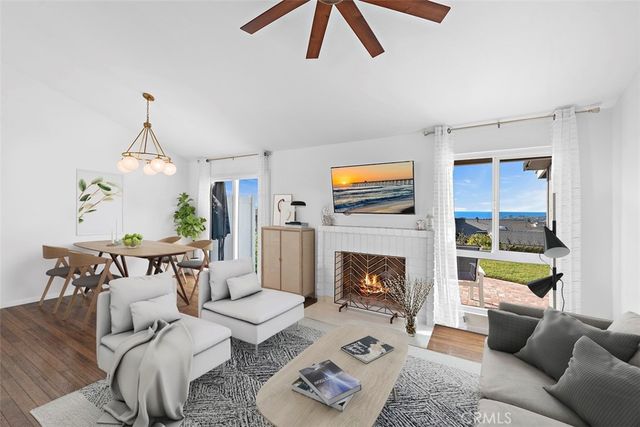 a view of a house with backyard porch and sitting area