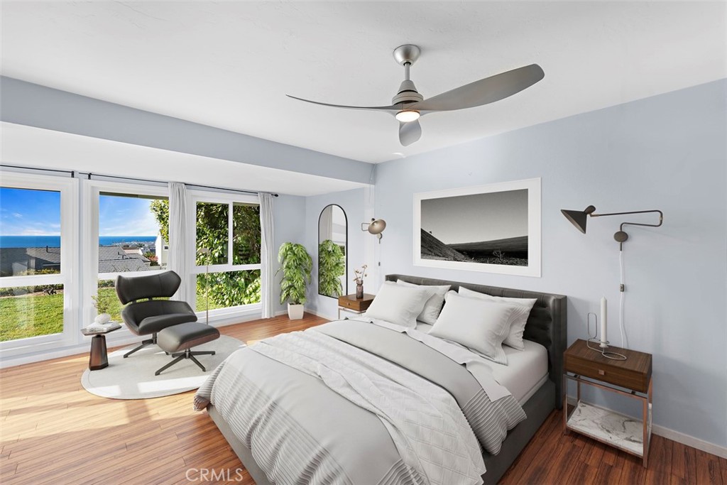 33525 Sextant Dana Point, CA 92629 - Photo 19 of 51 a bedroom with a bed and a large window