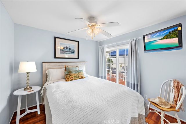 a view of a balcony with floor to ceiling windows