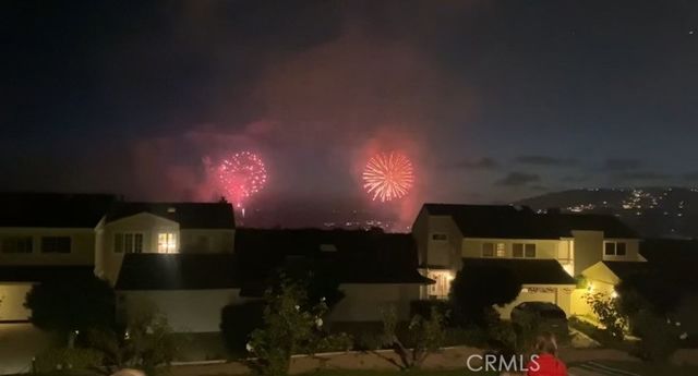 a kitchen with white cabinets and sink