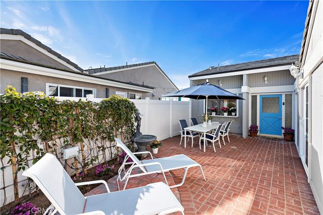 a kitchen with refrigerator cabinets and wooden floor