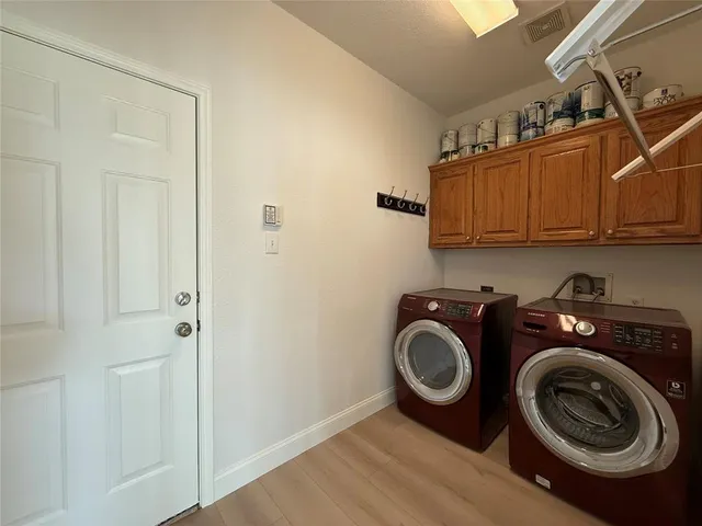 a view of a storage & utility room with washer and dryer