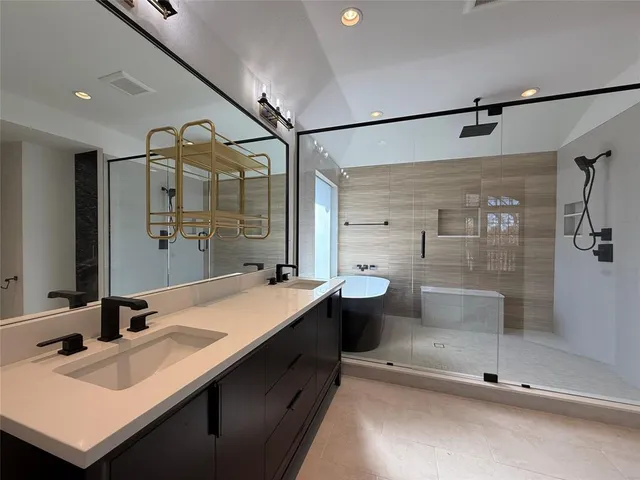 a bathroom with a sink and mirror