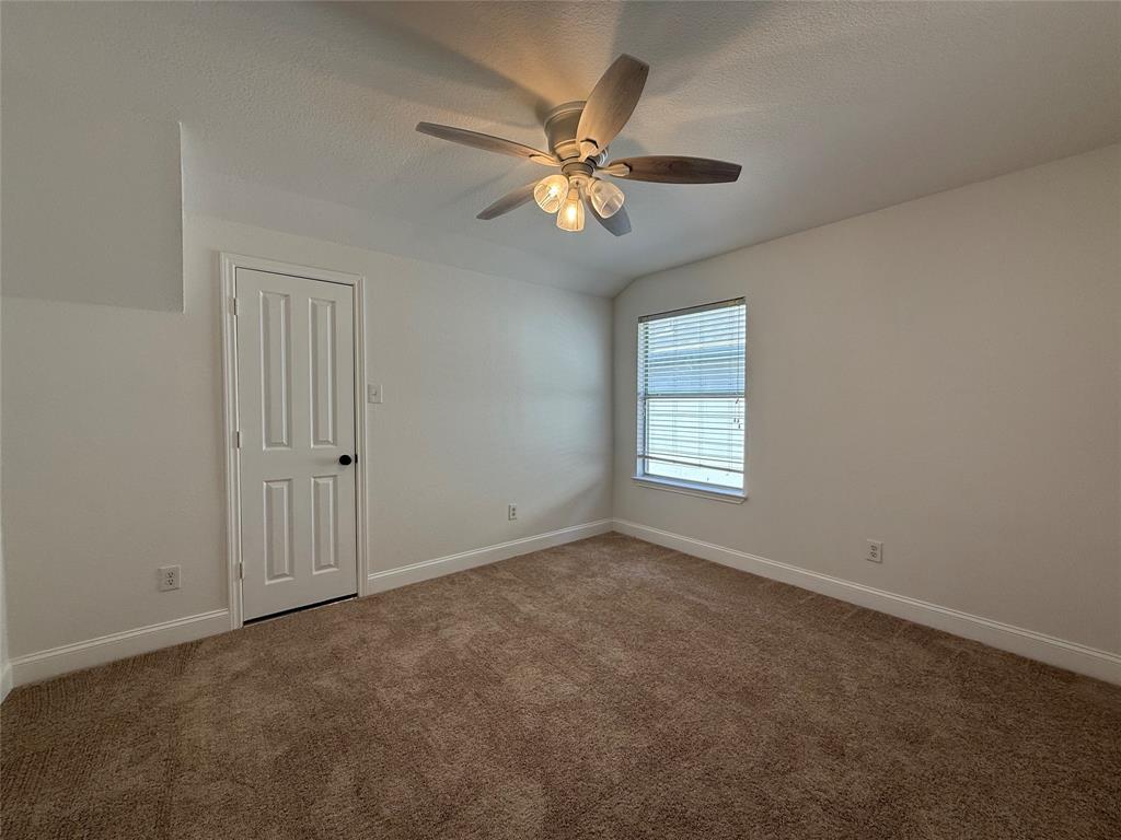 2254 Ash Grove Way Dallas, TX 75228 - Photo 7 of 23 a view of an empty room with a window