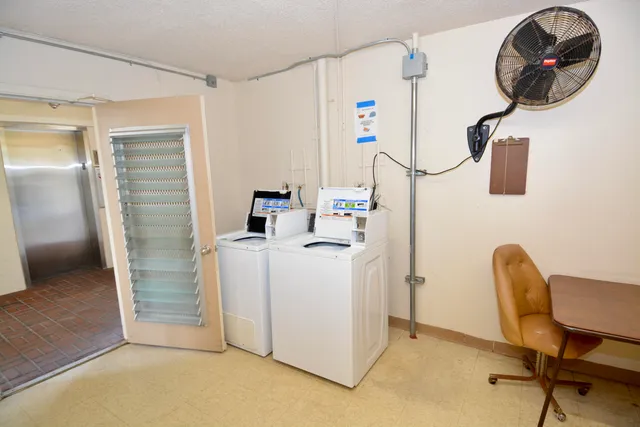 a workspace with furniture and a window