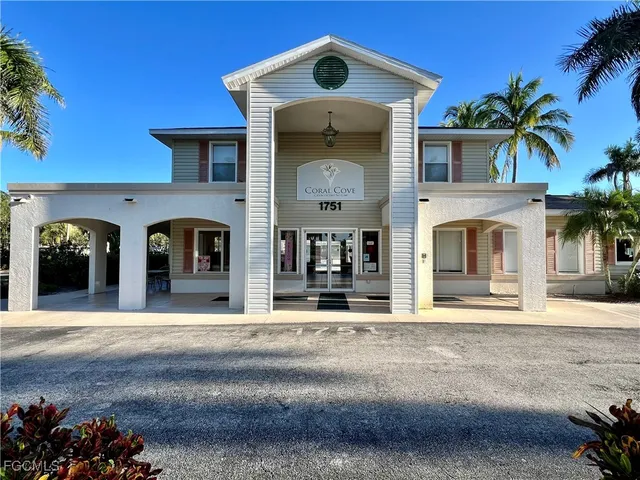a front view of a house with a garage