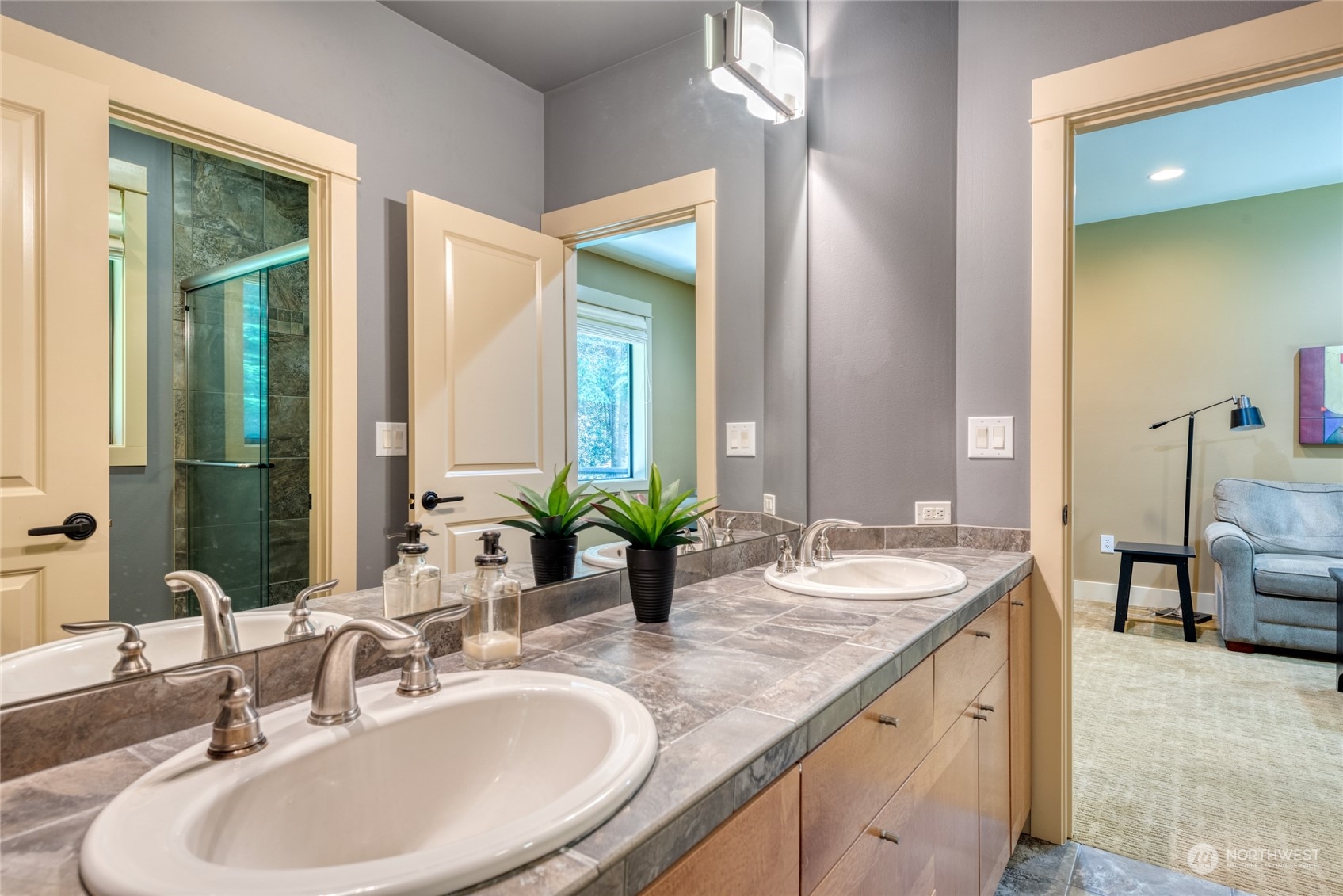 4635 D D Milluhr Road Northeast Olympia, WA 98516 - Photo 14 of 40 a bathroom with double vanity sinks and a mirror