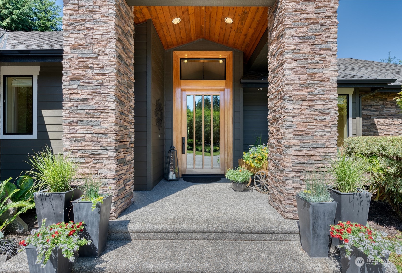 4635 D D Milluhr Road Northeast Olympia, WA 98516 - Photo 2 of 40 a view of a front door of the house with a chair