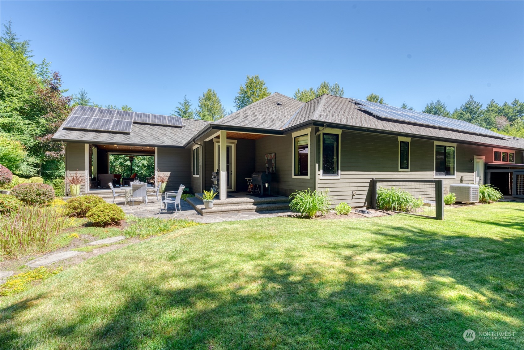 4635 D D Milluhr Road Northeast Olympia, WA 98516 - Photo 22 of 40 a view of a house with a yard patio and fire pit
