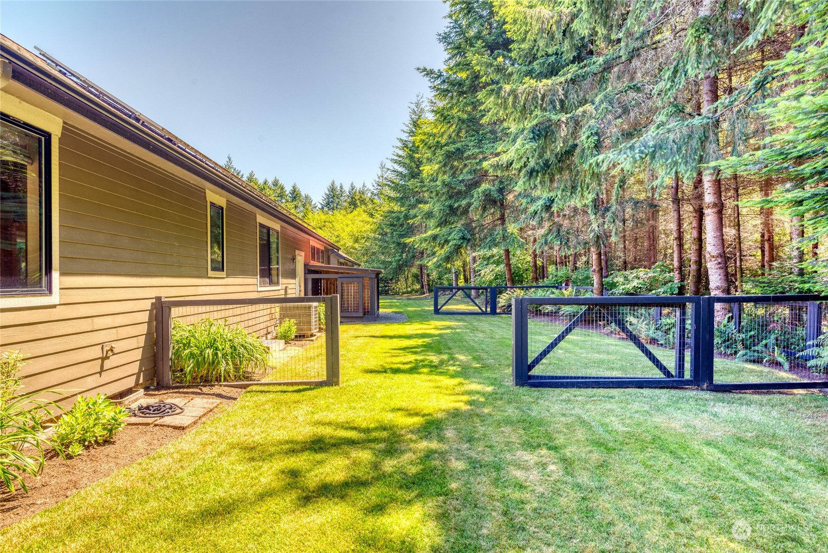 4635 D D Milluhr Road Northeast Olympia, WA 98516 - Photo 23 of 40 a view of a house with a swimming pool