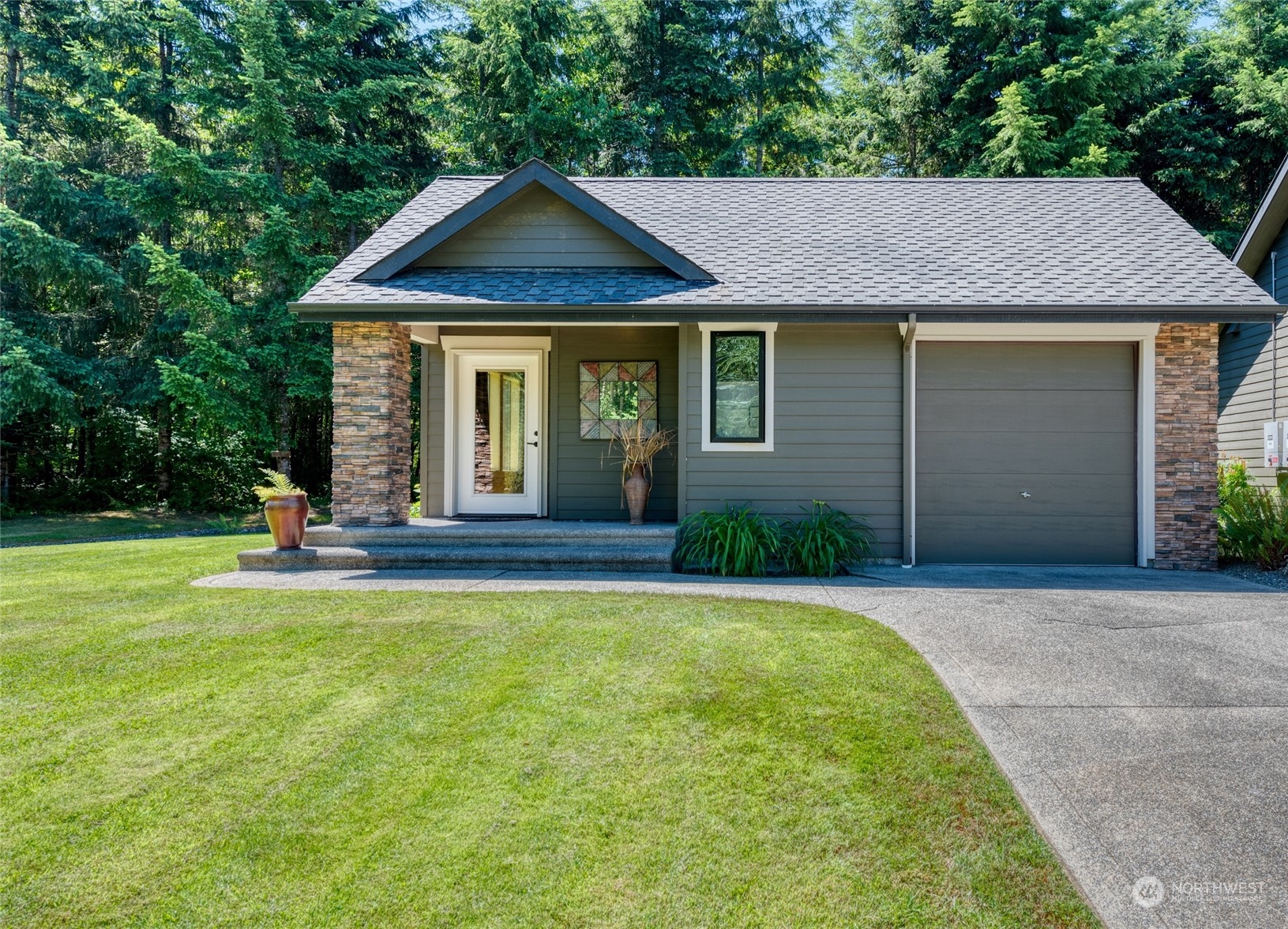 4635 D D Milluhr Road Northeast Olympia, WA 98516 - Photo 24 of 40 a front view of a house with a yard