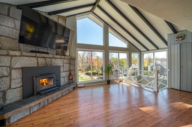 a living room with furniture flat screen tv and a fireplace