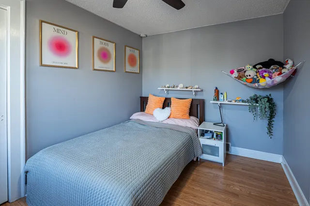 a bedroom with a bed and a couch